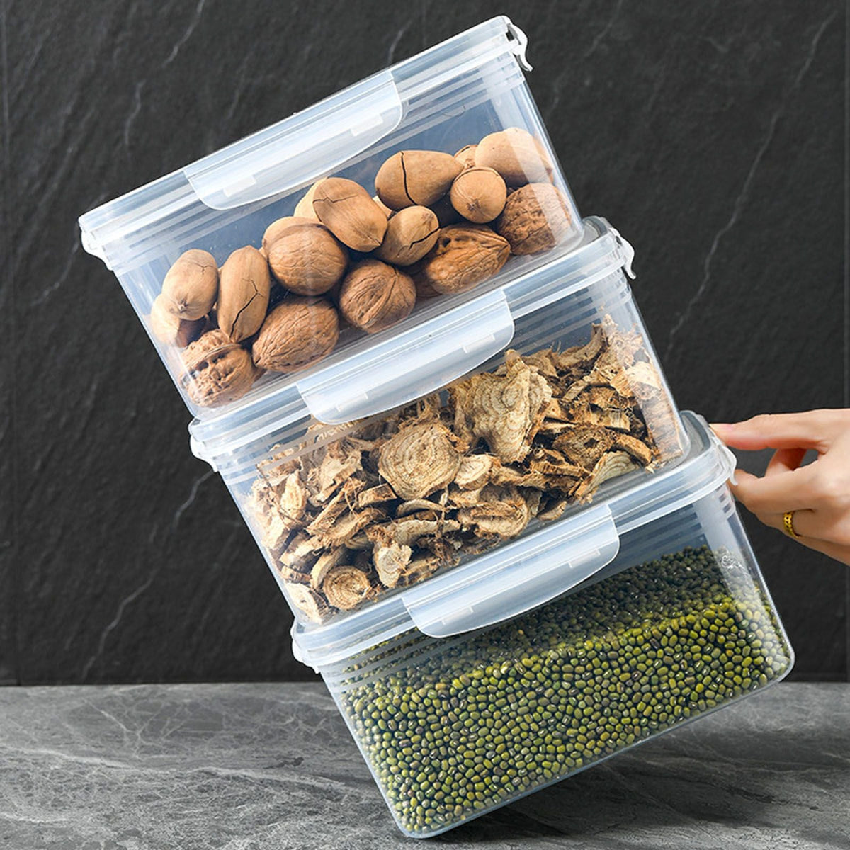 Drain Storage Basket Box with clear plastic rectangular containers, translucent lids and white clasps, stacked with assorted dry foods