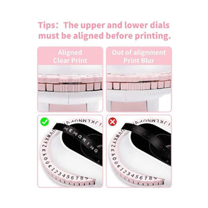 Embossing Label Maker E975 with pale pink character dials and black tape, showing aligned and misaligned printing examples