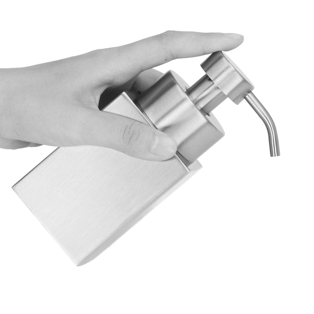 Foaming Soap Dispenser with a brushed silver stainless steel body, shown tilted as a hand presses its pump
