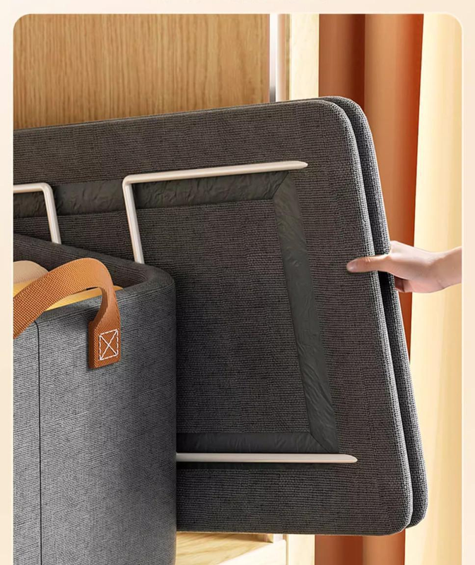 Foldable Fabric Storage Bin in charcoal gray woven fabric, showing its rigid metal frame and reinforced tan handle.