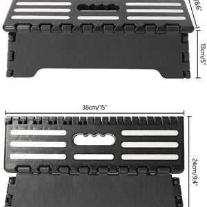 Folding Step Stool in black plastic with a textured anti-slip top, white grip strips, folding hinges and carry handle