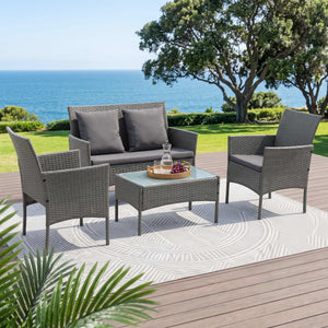 Gardeon 4-Piece Outdoor Sofa Set in grey woven rattan with dark cushions, two armchairs, a bench sofa and glass-top table