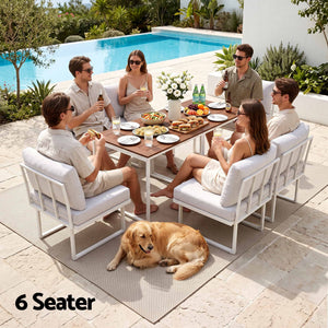 Gardeon 6 Seater Outdoor Dining set with white cushioned chairs, white steel frames and brown wood-look tabletop