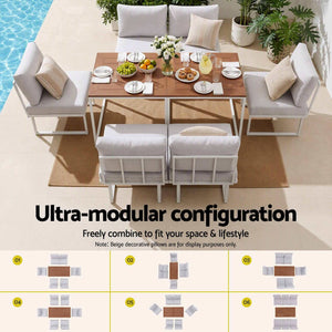 Gardeon 6 Seater Outdoor Dining set with white cushioned sofas, pale steel frames and two brown slatted tables