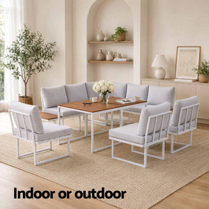 Gardeon 8 Seater Outdoor Dining Sofa Set with light grey upholstered cushions, white frames and wood-look dining table
