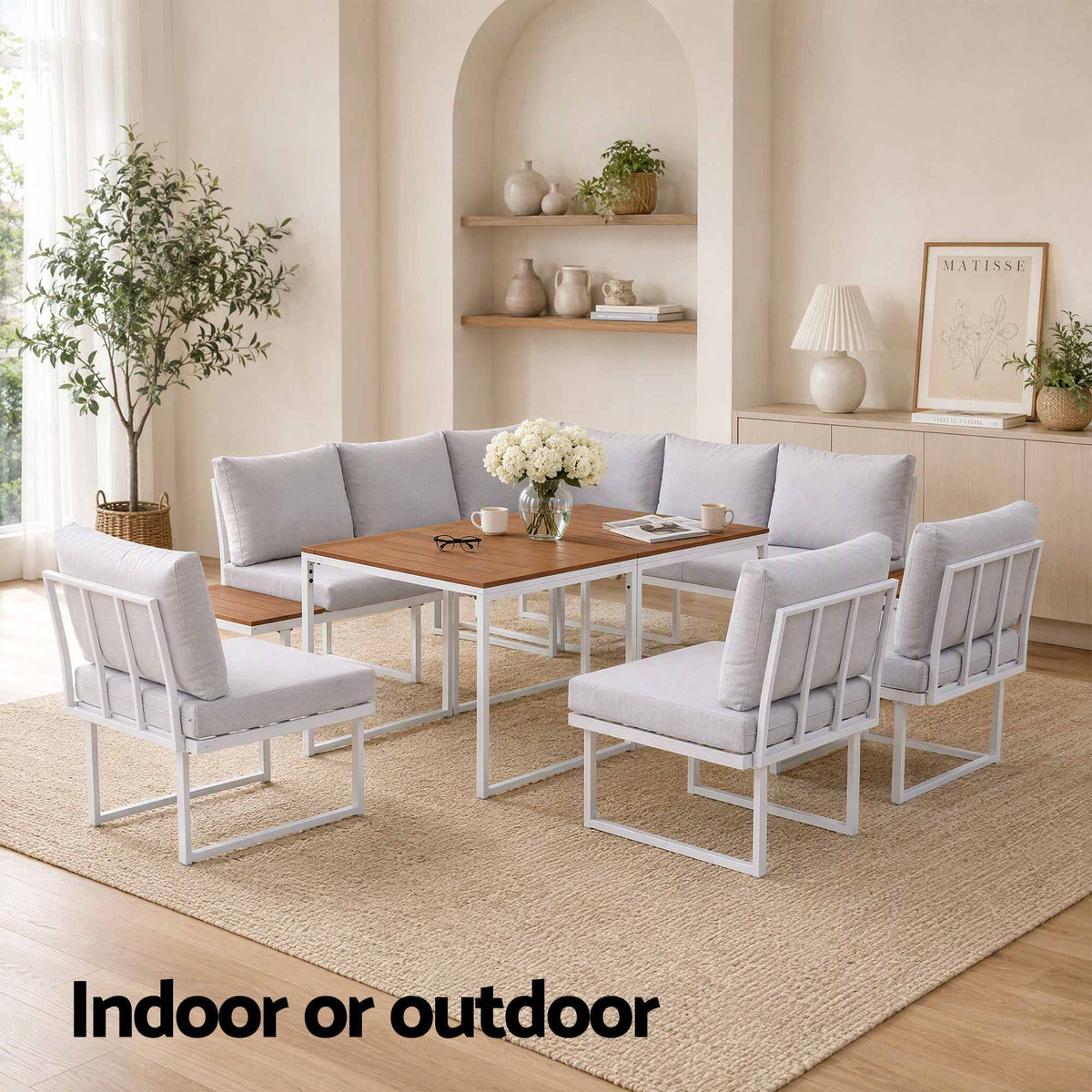 Gardeon 8 Seater Outdoor Dining Sofa Set with light grey upholstered cushions, white frames and wood-look dining table