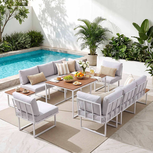 Gardeon 8 Seater Outdoor Dining Sofa Set with white cushioned modular sofas, pale frames and wood-look dining tables