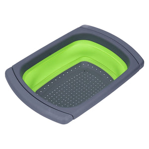 Green Foldable Drain Basket with a bright green silicone body, charcoal plastic rim and perforated draining base
