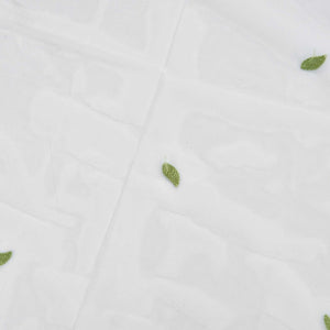Sheer voile curtain featuring Green Willow Leaves in a sparse print on translucent white polyester tulle.