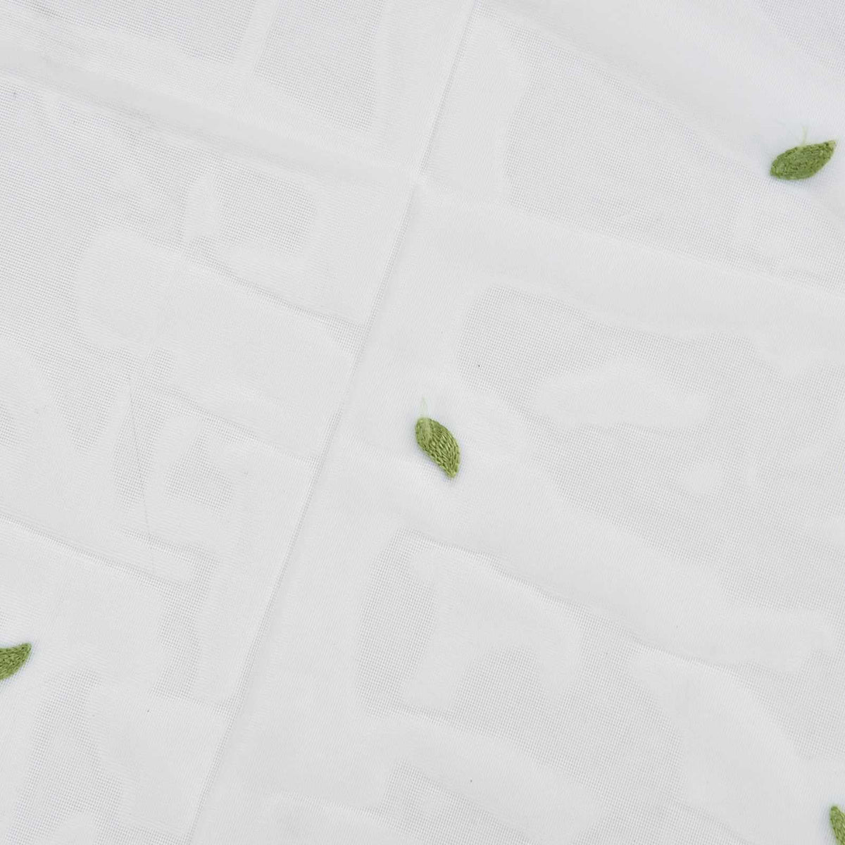 Sheer voile curtain featuring Green Willow Leaves in a sparse print on translucent white polyester tulle.