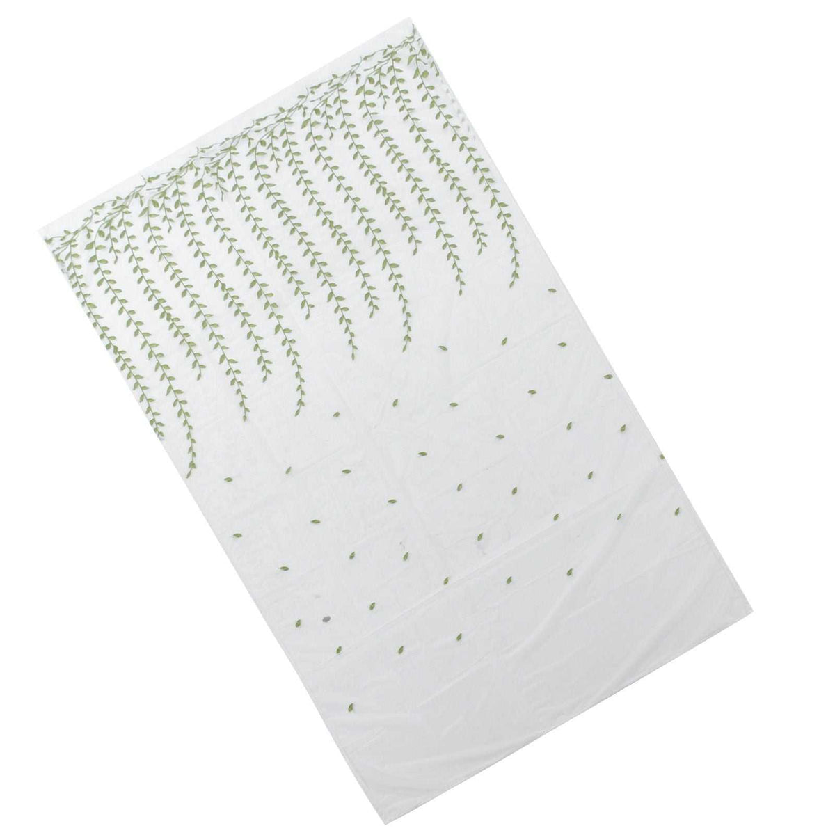 Sheer voile curtain in translucent white polyester with Green Willow Leaves print concentrated along one edge and sparse leaves below