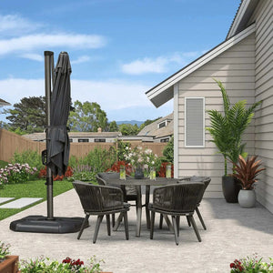 Grey Patio Cantilever Outdoor Umbrella with dark grey fabric canopy folded around a black pole and weighted base