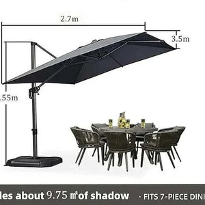 Grey Patio Cantilever Umbrella with a dark grey rectangular canopy, matching pole, crank arm and weighted base, shown over a dining set
