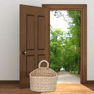 Hanging Basket Seagrass woven storage basket in natural beige with a rounded body and loop handle