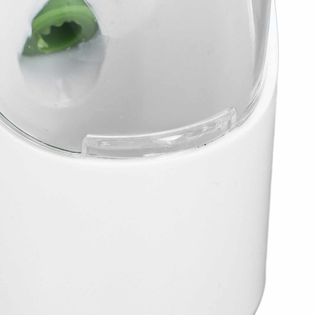 Herb Keeper Herb Storage Container, white plastic body with a clear curved window and green herb visible inside