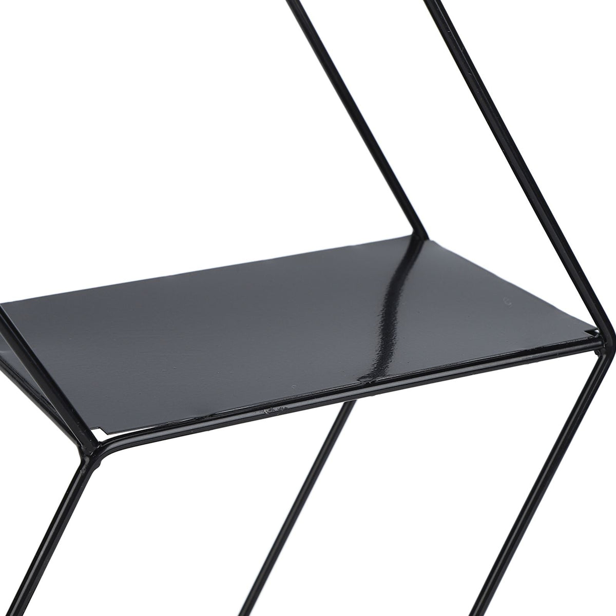 Hex Shelves in black wrought iron, featuring an open geometric hexagonal frame and a smooth solid display platform