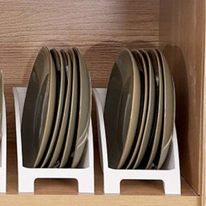 Japanese Kitchen Dish rack in white plastic, holding upright dark round plates with divided slots and raised side guards