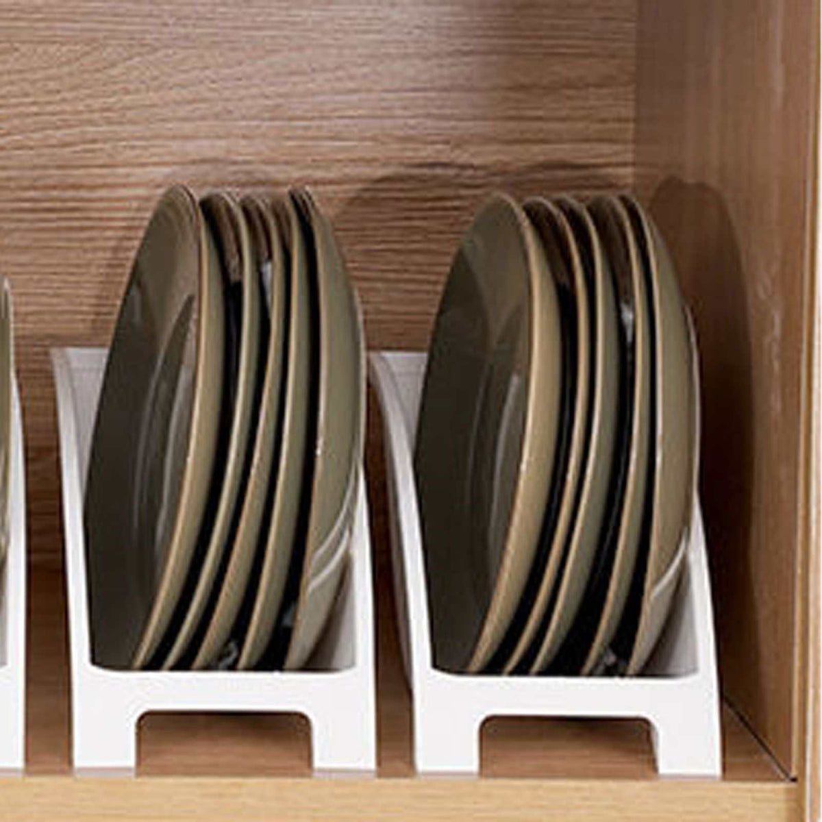 Japanese Kitchen Dish rack in white plastic, holding upright dark round plates with divided slots and raised side guards