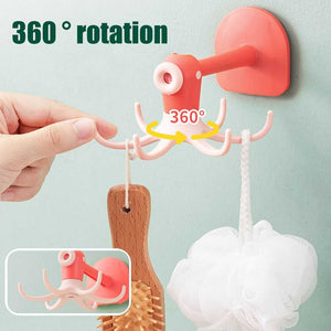 Kitchen 360° Rotated Hooks in coral plastic with a round adhesive base and multiple curved arms that rotate fully
