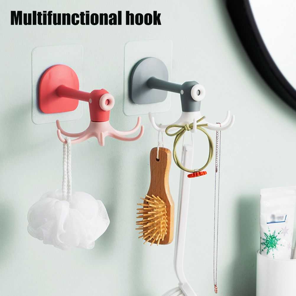 Kitchen 360° Rotated Hooks in pink and gray plastic, each with a round adhesive base and multi-pronged rotating arms holding bath accessories.