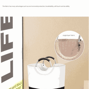 Laundry hamper with a white and black colour-block design, structured fabric body and curved metal handles; Large 90L Capacity