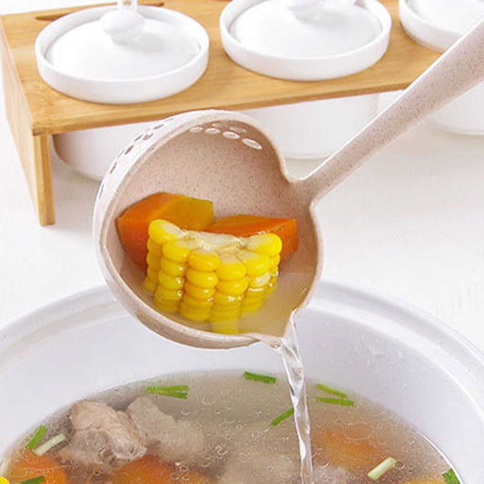 Long Handle Colander spoon in beige speckled material, with a perforated round bowl draining corn and vegetables