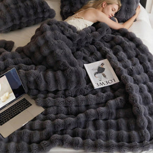 Luxury Tuscany Fleece throw blanket in charcoal grey faux fur with a plush raised bubble texture and deep pile