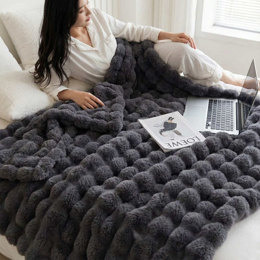 Luxury Tuscany Fleece blanket in plush dark grey faux fur with a raised, oversized bubble texture
