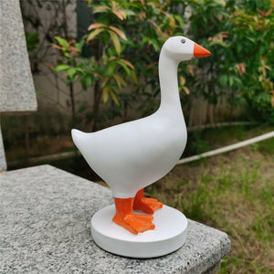 Magnetic Goose Key Holder in smooth white resin with an orange beak and feet, standing on a round base