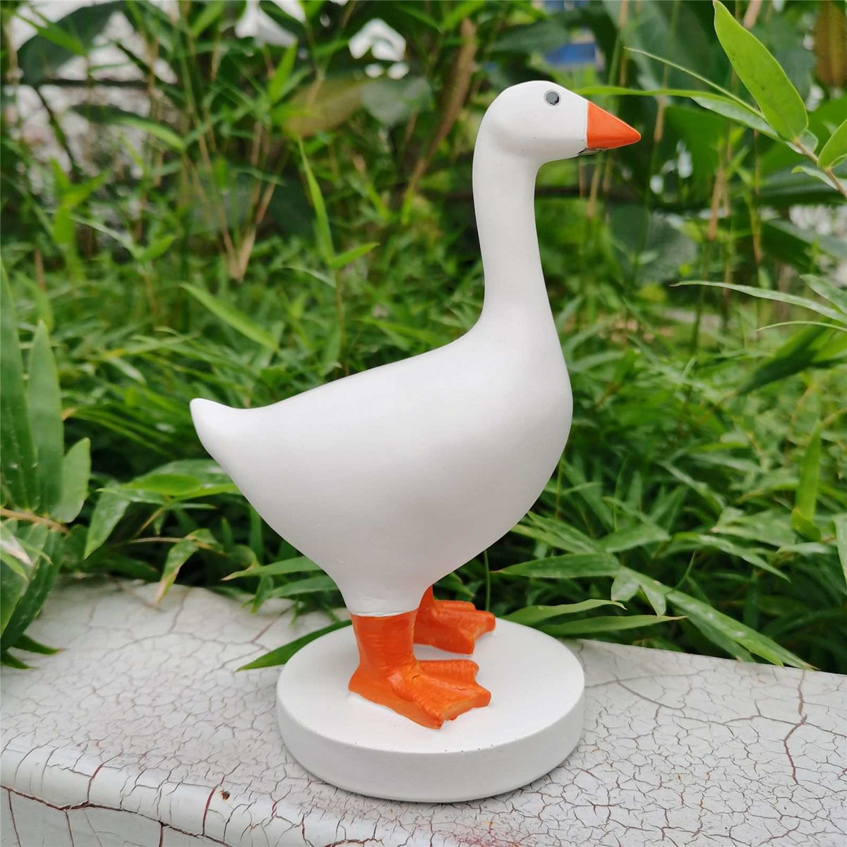 Magnetic Goose Key Holder, a white resin goose statue with an orange beak and feet on a round base