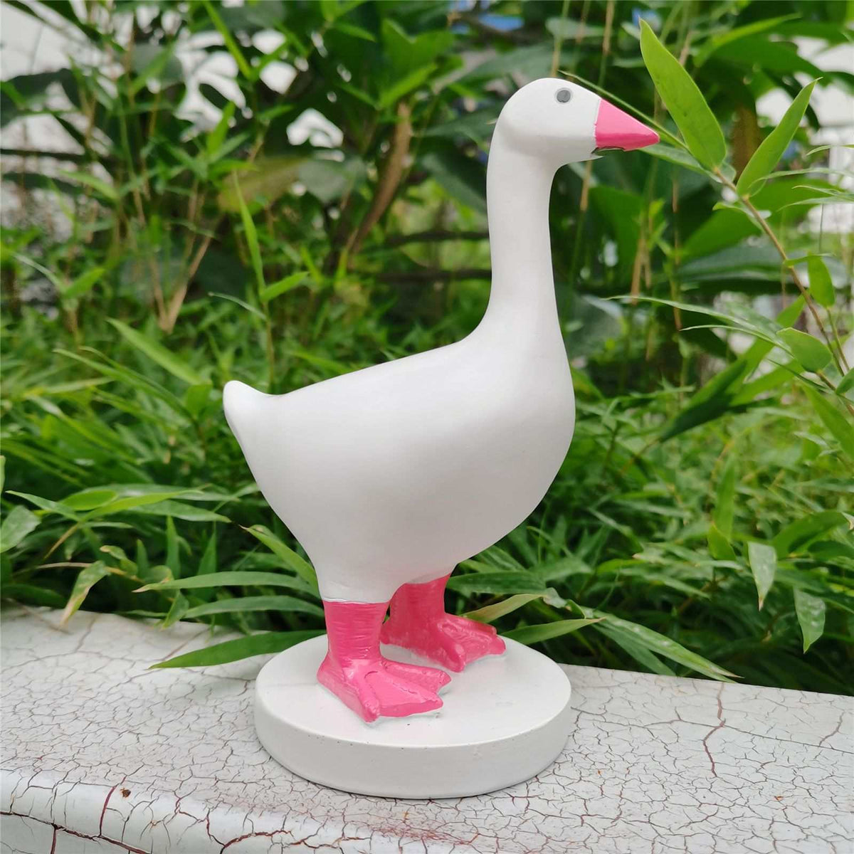Magnetic Goose Key Holder in white resin with a bright pink beak and feet, standing on a round base