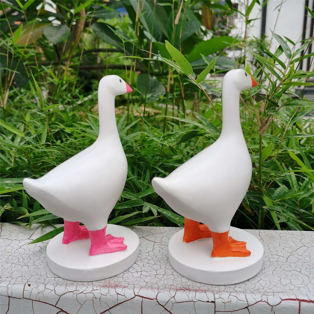 Magnetic Goose Key Holder statues in smooth white resin, with orange-red beaks and bright pink and orange webbed feet