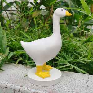 Magnetic Goose Key Holder in smooth white resin with a yellow beak and feet, standing on a round base