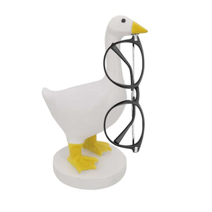 Magnetic Goose Key Holder in white resin with yellow beak and feet, holding black-framed glasses by its beak