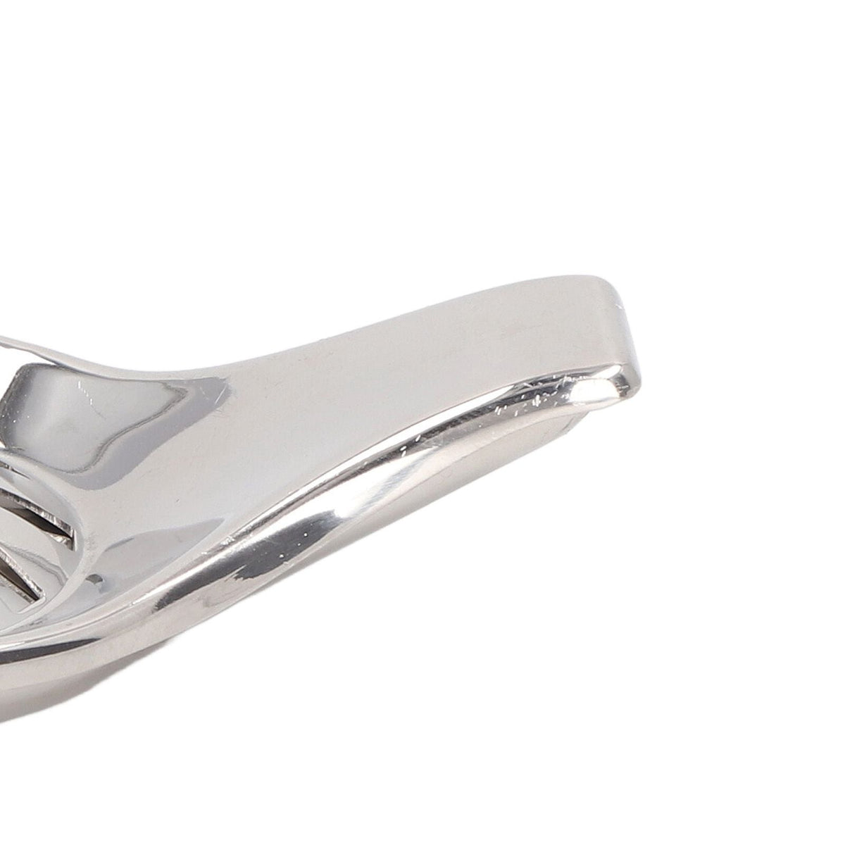 Manual Lemon Juicer in polished silver stainless steel, showing a smooth curved handle and firm clamp design