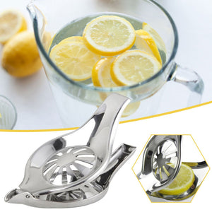 Manual Lemon Juicer in polished stainless steel, with a hinged clamp and perforated round press for citrus halves