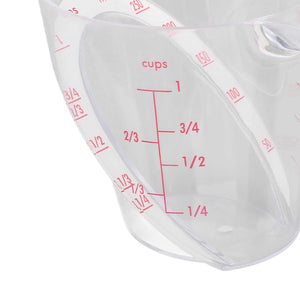 Measuring Cup Heat Resistant in clear transparent plastic with red dual-scale markings and an angled reading design