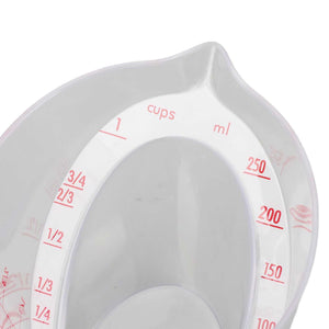 Measuring Cup Heat Resistant in clear plastic with red dual-scale markings, angled reading surfaces and a pouring spout
