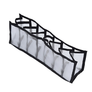 Mesh Bras Storage Box, a seven-cell white mesh drawer organiser with black fabric edging and dividers, shown unfolded