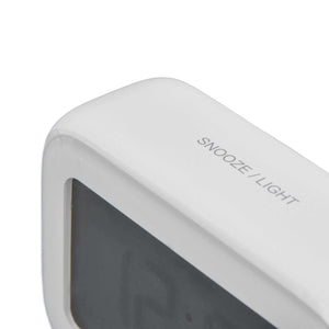 Mini Digital Alarm Clock in white ABS plastic, shown close up with a dark LCD screen and snooze-light button.