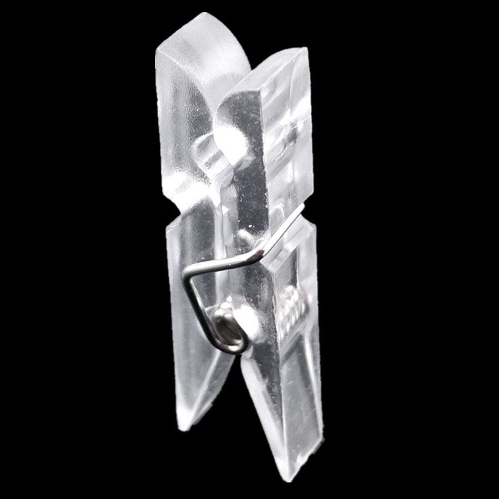 Mini Transparent Plastic clip in clear plastic with a silver metal spring, featuring a compact clothespin shape