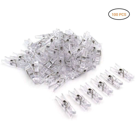 Mini Transparent Plastic clips in clear plastic with small metal springs, shown in a loose pile with 100 pieces.