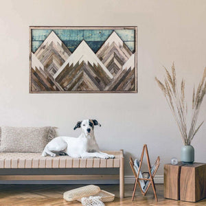 Mountain Wood Wall Art featuring layered geometric mountain peaks in weathered grey and brown wood with blue accents