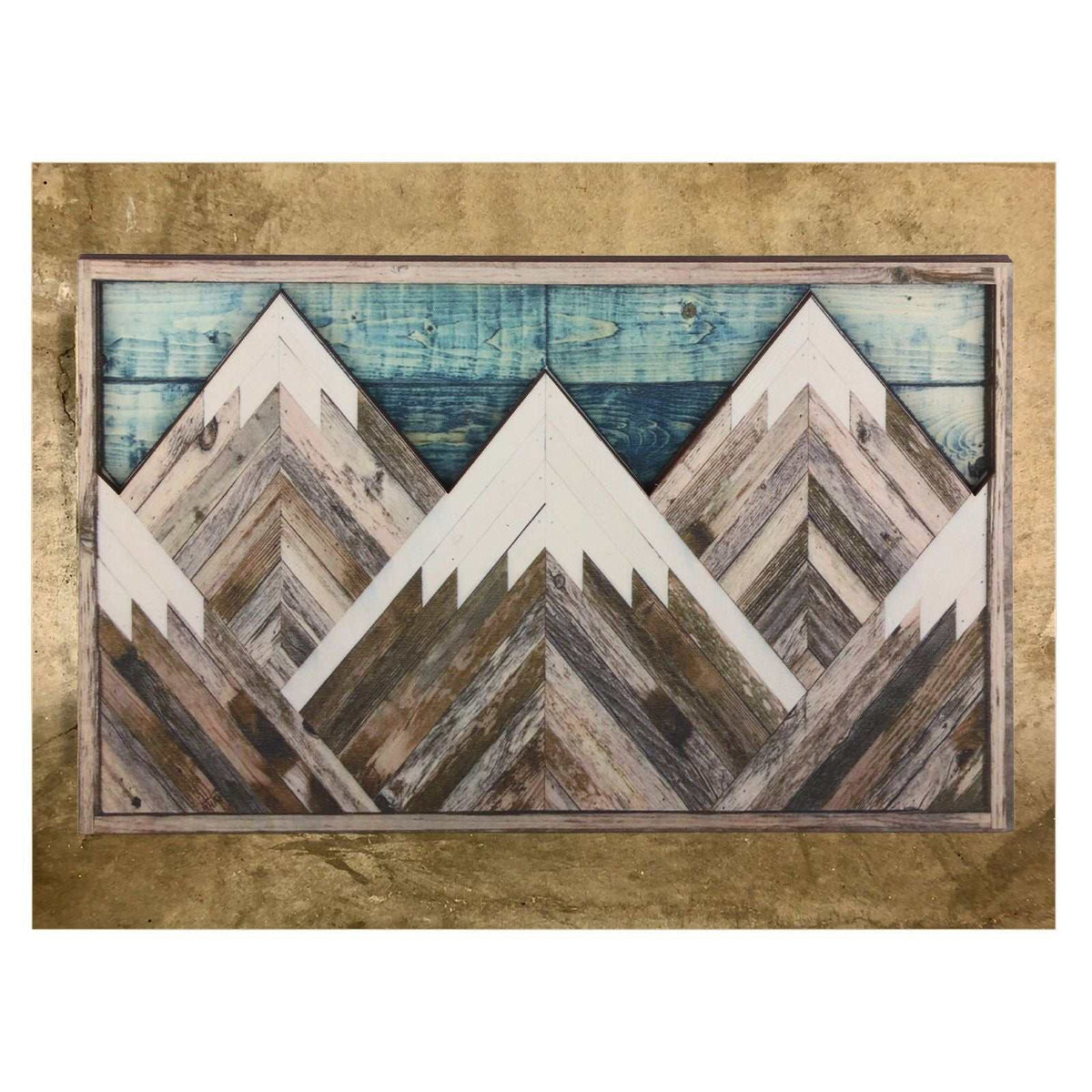 Mountain Wood Wall Art featuring layered geometric peaks in weathered brown, grey and white wood with a blue plank sky