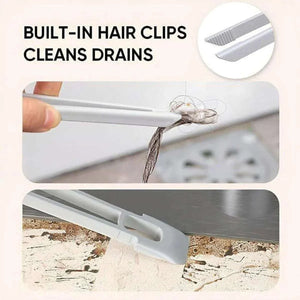 Multifunctional 360° Rotary Cleaning Brush in white plastic with built-in hair clips and a flat scraper tail for cleaning drains