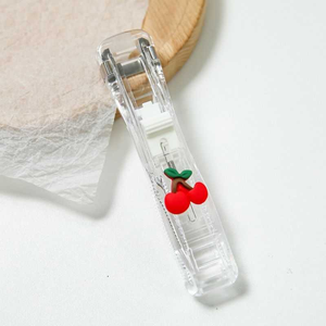 Office Supplies Push Stapler with a transparent plastic body and a bright red cherry design on the handle.