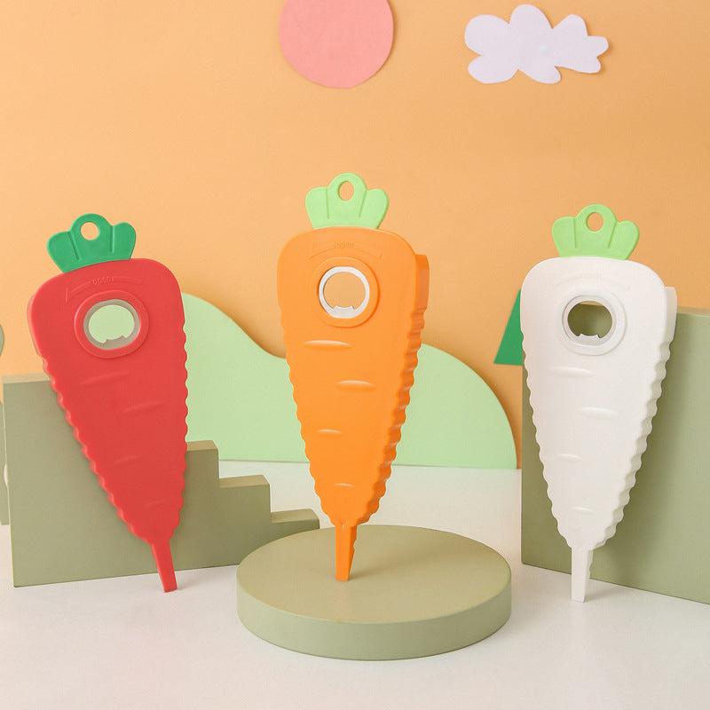 Orange Carrot-Shaped Multi-Function Bottle Opener in textured plastic with green leafy tops and circular metal opener