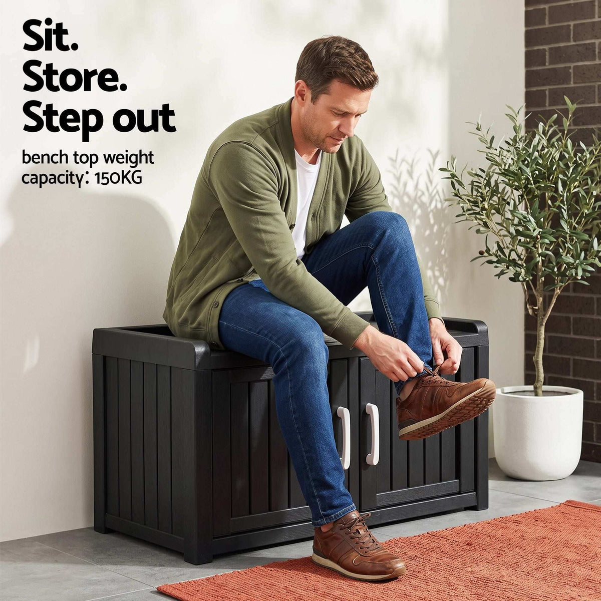 Outdoor Storage Box Bench in black resin with a wood-look slatted finish, double doors and silver handles, shown as a seat