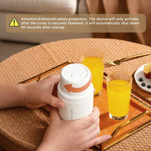Personal Juicer with a white cylindrical body, screw-on lid and orange directional arrow marking on the cap
