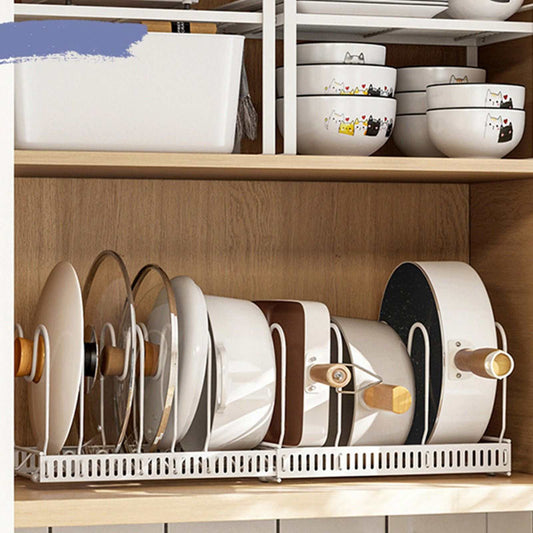 Pot Lid Rack Iron in a white wire frame holds pot lids upright with adjustable slots inside a wooden cabinet.